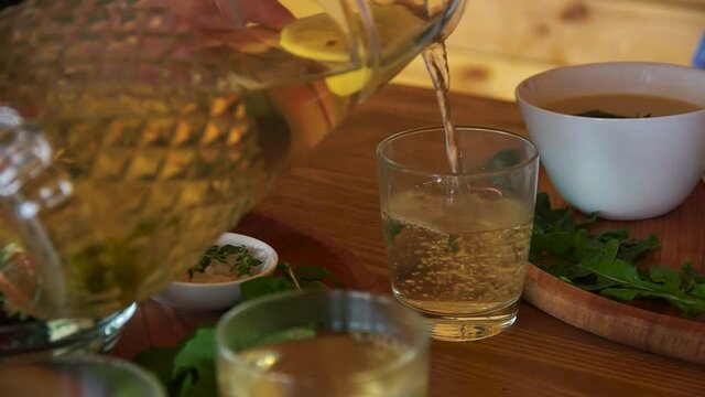 pouring compote into an empty glass