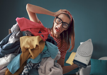 Frustrated housewife ironing clothes