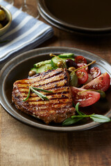 Grilled Turkey Breast with fresh salad. Close up.	