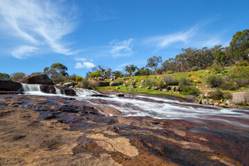 John Forest National Park in winter season, with the falls full of water and a blue sky