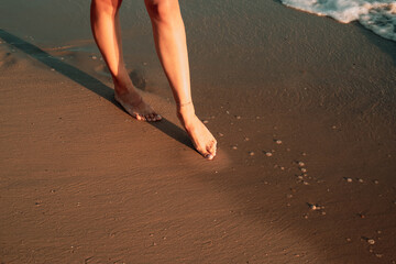girl feet, footpath on the beach