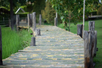 The bridge is made of beautiful curved bamboo.