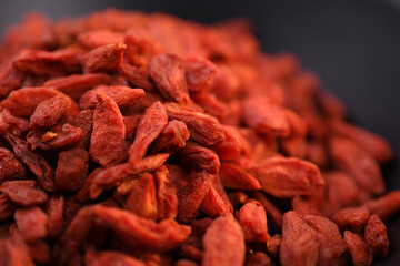 Close-up of Goji berries in black bowl