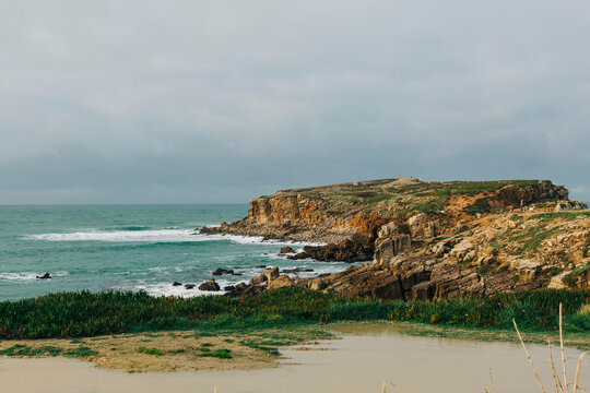 Scenic view limestone peninsula and ocean, Peniche, Portugal
