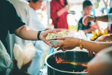 concept of free food serving : Volunteers serving food for poor people
