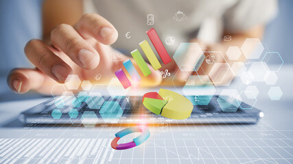 Businessman holding graphs in hand