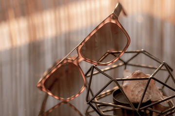 Fototapeta na wymiar Classic sunglasses model shoot in a sunny day closeup. Selective focus