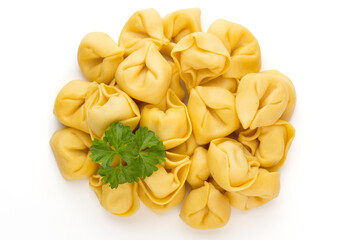 Raw homemade pasta,tortellini with herbs.