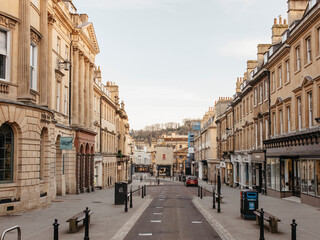 Buildings along empty main street, Bath, Somerset, UK
