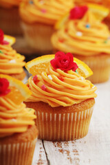 Cupcakes with orange icing on top