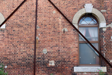 Closeup of bricks and window of old colonial building around Moji Station