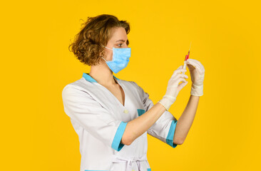 Doctor with syringe is preparing for injection. injection against coronavirus. virus epidemic...