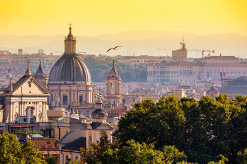 Fototapeta na wymiar Cityscape view of historic center of Rome, Italy from the Gianicolo hill during summer sunny day sunset