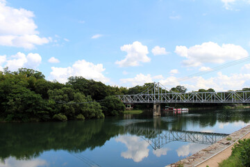 Bridge connecting Okayama Korakuen Garden and its reflection