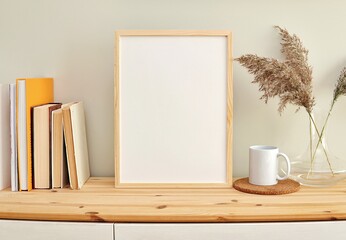 Boho style wooden frame mockup for artwork presentation, books, coffee mug.