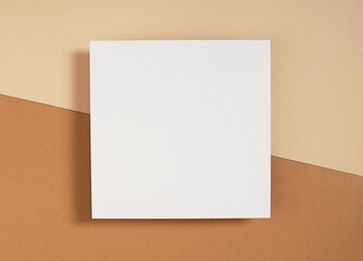 Square empty card mockup, for invitation, thank you card, greeting card design, blank paper on brown background with shadow, flatly, top view.