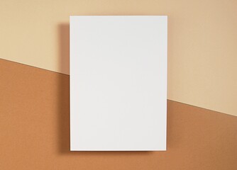 Vertical empty card mockup, for invitation, thank you card, greeting card design, blank paper with shadow on brown background, modern flatly, top view.