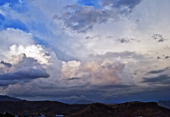 Rain clouds have accumulated on the top of Vayots sar volcanic mountain