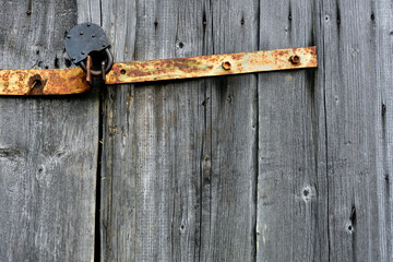 very old wooden gates closed on the castle, background