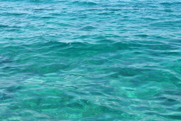 transparent calm turquoise sea surface background