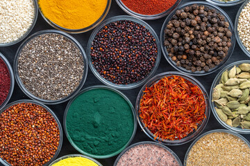 Assortment colorful spices, seeds and herbs for cooking food, top view