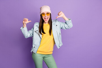 Portrait of energetic crazy girl point thumb herself enjoy her choose decide choice decision for lottery victory wear yellow green pants isolated over purple color background