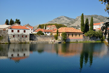 Fototapeta na wymiar View of Old Town of Trebinje on the bank of Trebisnjica river in a sunny day, Bosnia and Herzegovina