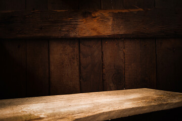 Old wooden table top with smoke on a dark background..