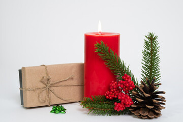 Christmas composition. Christmas gifts, pine branches, candle. Flat lay, top view.