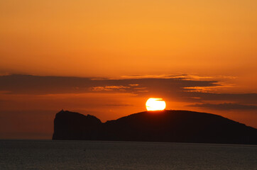 sunset over capo caccia, alghero, sardinia, italy