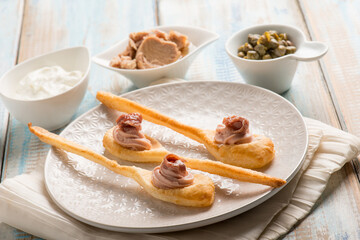 spoon canapes with tuna cream anchovies and capers