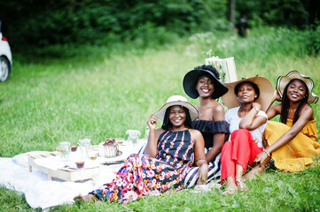 Group of african american girls celebrating birthday party outdoor with decor.