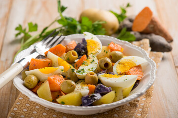 mixed salad with egg purple potatoes and olives