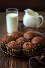 Close-up chocolate banana muffins with milk. Selective focus
