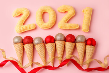 Set of ice Cream Cones with Christmas Decoration and number of year 2021, Christmas New Year Concept, pink pastel background, winter holiday flyer, coupon, card