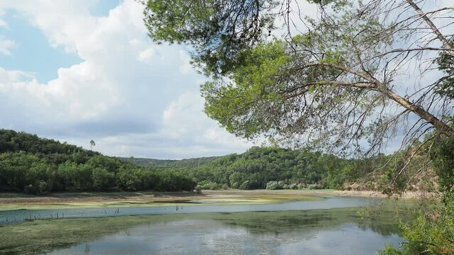 Video of the lake of Sainte Suzanne called lac de Carc&egrave;s in Provence Var, during water pumping and low level of the dam in dry period
