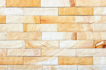 Fototapeta premium Sandstone yellow wall texture for background.