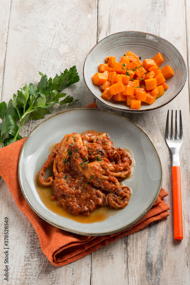 Poster baby octopus with tomato sauce and pumpkin salad