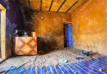 watercolor illustration: Inside a rest stop in the desert of Sudan with a blue carpet and a stove where food, tea and coffee are prepared.