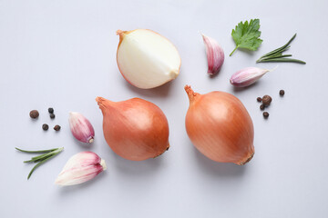 Obraz na płótnie Canvas Flat lay composition with onions and spices on light background