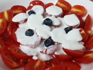 Green vegan salad from green leaves mix and vegetables. eat clean  for heaalthy.Top view on gray stone table.