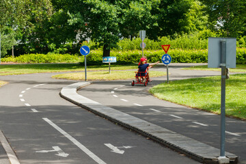 Traffic educational experience - practice park for children. Mini car road, traffic sign and traffic light