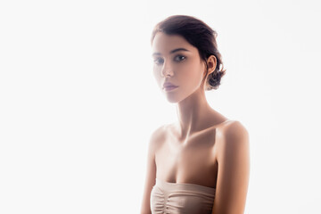 Fototapeta premium brunette young woman looking at camera isolated on white