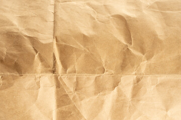 Craft paper.  Crumpled brown cardboard paper texture. Old Crumpled recycled paper texture, color beige. Brown background