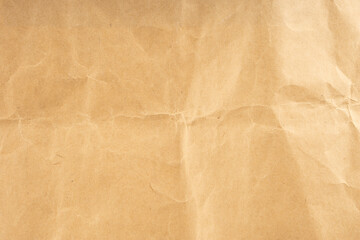 Craft paper.  Crumpled brown cardboard paper texture. Old Crumpled recycled paper texture, color beige. Brown background