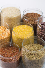 Many different types of haricot beans in studio on black
