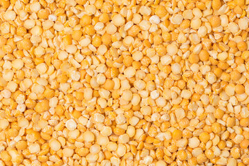 Yellow split peas on white in studio