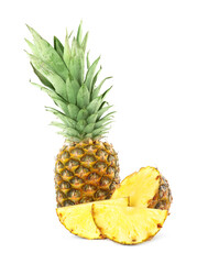 Fototapeta na wymiar Whole and cut juicy pineapples isolated on white