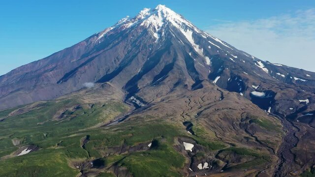 Aerial around view of the Koryaksky volcano on Kamchatka peninsula, Russia, 4k