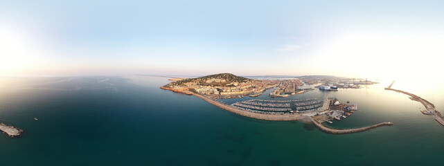 Obraz na płótnie Canvas 360º Aerial panorama of the city and port of Sete on a summer morning, in Herault in Occitanie, France